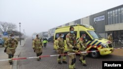 Emergency responders secure the area at the scene of an explosion at a coronavirus testing location in Bovenkarspel, near Amsterdam, Netherlands, March 3, 2021. 