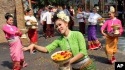 Dancers perform traditional dance during the opening ceremony of ancient Thai New Year or Songkran festival celebrations.