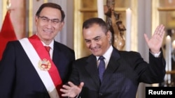 Peru's President Martin Vizcarra and new Finance Minister Carlos Oliva gesture during a swearing-in ceremony at the government palace in Lima, Peru, June 7, 2018.