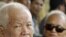 Former Khmer Rouge leaders Khieu Samphan, left, and Nuon Chea, right, look on during the funeral for Khieu Ponnary, the first wife of Khmer Rouge leader Pol Pot, in 2003. 
