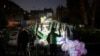 A street vendor flashes a victory sign in the Bab Touma neighborhood in the Old City of Damascus, Syria, Dec. 14, 2024.