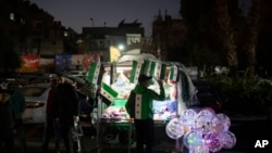 A street vendor flashes a victory sign in the Bab Touma neighborhood in the Old City of Damascus, Syria, Dec. 14, 2024.