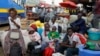 Passengers wait to board a disinfected public transport bus amid concerns about the spread of coronavirus disease in downtown Nairobi, Kenya, March 20, 2020. 