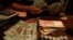 An employee counts U.S. dollar banknotes at a foreign exchange house in Ciudad Juarez, Mexico, Nov. 8, 2016. Mexico will likely raise interest rates to support its currency in the wake of the U.S. election.
