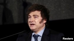 FILE PHOTO: Argentina's President Javier Milei delivers a speech during a lunch of the Uruguay's Marketing Managers Association (ADM), on the sidelines of the Mercosur Summit, in Montevideo