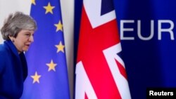 British Prime Minister Theresa May leaves after holding a news conference following an extraordinary European Union leaders summit to discuss Brexit, in Brussels, Belgium, April 11, 2019. 