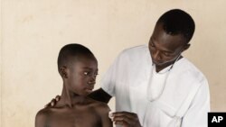 FILE - A young boy prepares for vaccination. (Photo: Business Wire)