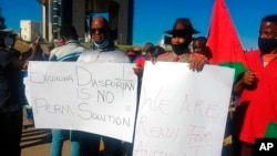 FILE - People protest in Windhoek, Namibia, May 28, 2021. Germany had just reached an agreement with Namibia to officially recognize as genocide the colonial-era killings of tens of thousands of people and commit to spending $1.3 billion, largely on development projects.