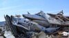 Damaged planes and property are seen at the John C. Tune Airport after a tornado hit Nashville, Tennessee, March 3, 2020.