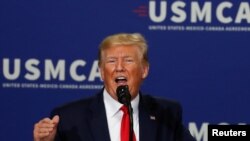 FILE - U.S. President Donald Trump delivers remarks on supporting the passage of the U.S.-Mexico-Canada (USMCA) trade deal in Milwaukee, Wisconsin, July 12, 2019. 