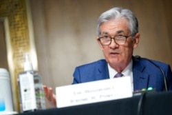 FILE - Chairman of the Federal Reserve Jerome Powell speaks during a Senate Banking Committee hearing on Capitol Hill in Washington, Dec. 1, 2020.