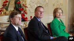 In this photo taken April 8, 2010, Michael McFaul, from left, the administration's top Russian expert, is seen with National Security Advisor Gen. Jim Jones, and Secretary of State Hillary Rodham Clinton, during a photo opportunity prior to a bilateral me