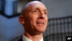 Carter Page, a foreign policy adviser to Donald Trump, speaks with reporters, Nov. 2, 2017, following a day of questions from the House Intelligence Committee, on Capitol Hill in Washington.