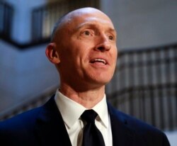 FILE - Carter Page, a foreign policy adviser to Donald Trump, speaks, Nov. 2, 2017, with reporters following a day of questions from the House Intelligence Committee, on Capitol Hill in Washington.