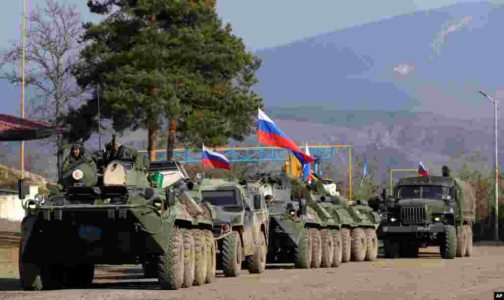 Military vehicles of Russian peacekeepers are seen at a check point on the road to Shusha in the separatist region of Nagorno-Karabakh.