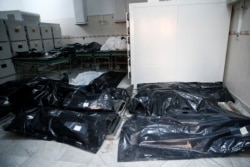 Bags with bodies of migrants who died after an air strike hit a detention center for mainly African migrants in Tajoura are seen in Tripoli Central Hospital, Libya, July 3, 2019.