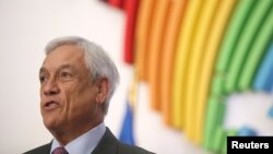 FILE - Chile's President Sebastian Pinera attends a press conference at the VIII Summit of the Americas in Lima, Peru, April 14, 2018. 