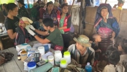 A Free Burma Rangers volunteer examines a baby in Yeh Mu Plaw village, Karen state, Myanmar, June 10, 2021. (Courtesy Image: Free Burma Rangers)