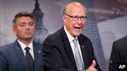 Sen. Pat Roberts (r) with Sen. Cory Gardner speaks about the Guantanamo Bay Detention Facility, Nov. 5, 2015, during a news conference on Capitol Hill in Washington. 