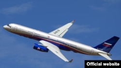 Russian Tupolev-214 airplane with the Open Skies sign featured at the Russian Defense Ministry Wensite