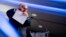 FILE - Rudy Giuliani, an attorney for President Donald Trump, pretends to tear a piece of paper as he speaks about the Iran nuclear agreement at the Iran Freedom Convention for Human Rights and Democracy at the Grand Hyatt in Washington, May 5, 2018.