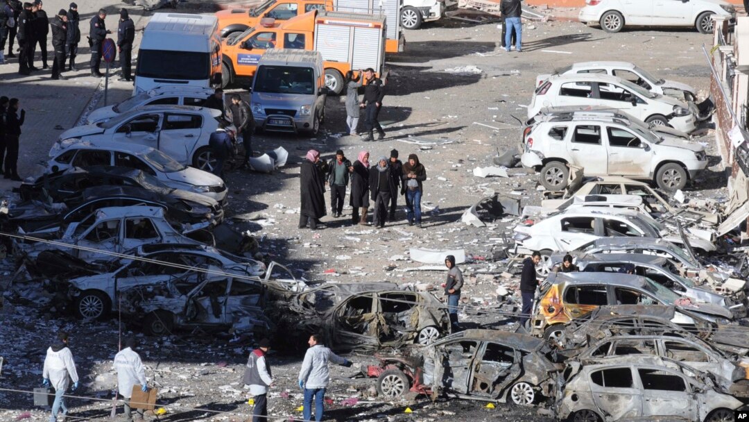 People inspect the damage from an overnight bomb attack in Viransehir, Turkey, Feb. 18, 2017. The bomb exploded near the homes of judges and prosecutors in the mainly-Kurdish town in Sanliurfa province, which borders Syria.
