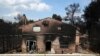 A burned house is seen in Agios Andreas, east of Athens, Tuesday, July 24, 2018. 