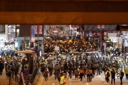 Riot police arrive to disperse protesters at Causeway Bay during the anti-extradition bill protest in Hong Kong, Aug. 4, 2019.