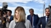 FILE - Actor Lori Loughlin and her husband, fashion designer Mossimo Giannulli, leave the federal courthouse after a hearing on charges in a nationwide college admissions cheating scheme, in Boston, Mass., Aug. 27, 2019.