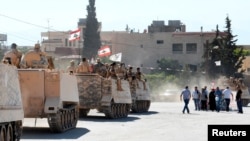 Lebanese army are greeted by civilians in Ras Baalbek, Lebanon, Aug. 27, 2017.