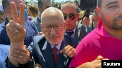 FILE - Tunisia's Islamist movement leader Rached Ghannouchi gestures upon arrival at court in Tunis, Tunisia July 19, 2022. 