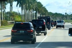President Donald Trump's motorcade drives to Trump International Golf Club, Dec. 25, 2020, in West Palm Beach, Fla.