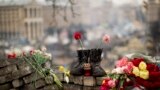 A pair of boots sit on top of a barricade at Independence Square, the epicenter of current unrest in Kyiv. Ukraine put its police on high alert after dozens of armed pro-Russia men stormed and seized local government buildings in country&#39;s Crimea region and raised a Russian flag over a barricade.