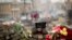 A pair of boots sit on top of a barricade at Independence Square, the epicenter of current unrest in Kyiv. Ukraine put its police on high alert after dozens of armed pro-Russia men stormed and seized local government buildings in country's Crimea region and raised a Russian flag over a barricade.