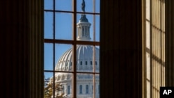 FILE - The morning sun illuminates the rotunda of the Russell Senate Office Building on Capitol Hill in Washington, Nov. 10, 2020.