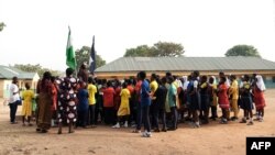 The principal of Government Secondary School, Tudun Wada, announcing the closure of schools to students at the assembly ground following an order by the Nigerian Government amid fears of the spreading of the COVID-19, in Abuja, March 20, 2020.