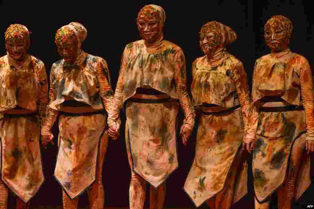 Students from Syiah Kuala University&#39;s Faculty of Arts and Design stand onstage after performing a contemporary dance as part of their final examinations in Banda Aceh, Indonesia.