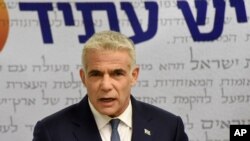 FILE - Chairman of the Yesh Atid Party, Yair Lapid, delivers a statement to the press in the Knesset, the Israeli Parliament, in Jerusalem on May 31, 2021. 