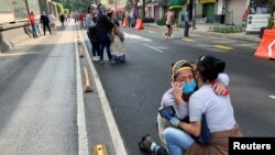 People react during an earthquake in Mexico City, Mexico June 23, 2020.