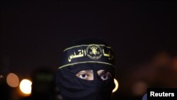 An Islamic Jihad militant marches during an anti-Israel military show in Gaza City September 27, 2012. 