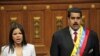 A daughter of the late Hugo Chavez, Maria Gabriela Chavez and Venezuela's newly sworn-in President Nicolas Maduro join in the singing of their national anthem in the National Assembly, in Caracas, Venezuela, April 19, 2013. 