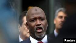 FILE - Gambia's Justice Minister Abubacarr Tambadou speaks outside the International Court of Justice, at The Hague, Netherlands, Jan. 23, 2020.