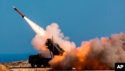 FILE - In this Nov. 8, 2017, photo from the U.S. Department of Defense, soldiers fire the Patriot weapons system at the NATO Missile Firing Installation in Greece. Sources say - unofficially - the U.S. is preparing to send the system to Ukraine to shoot incoming Russian missiles.