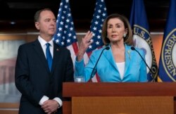 FILE - Speaker of the House Nancy Pelosi is joined by House Intelligence Committee Chairman Adam Schiff at a news conference as House Democrats move ahead in the impeachment inquiry of President Donald Trump, at the Capitol, Oct. 2, 2019.