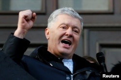 FILE - Former Ukrainian President Petro Poroshenko greets supporters in Kyiv on Jan. 19, 2022. Poroshenko and other political rivals of President Volodymyr Zelenskyy agree that elections cannot be held at the moment.