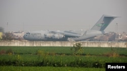 A U.S. military plane deporting Indian immigrants lands in Amritsar, India Feb. 5, 2025. 