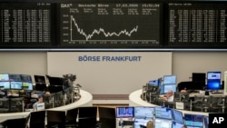 FILE - The curve of the German stock index DAX is seen at the stock market in Frankfurt, Germany, March 17, 2020.