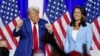 FILE - U.S. President Donald Trump dances as he leaves the stage alongside former U.S. Representative Tulsi Gabbard during a town hall in La Crosse, Wisconsin, on Aug. 29, 2024. The Senate on Feb. 12, 2025, approved Gabbard's nomination to be director of national intelligence.