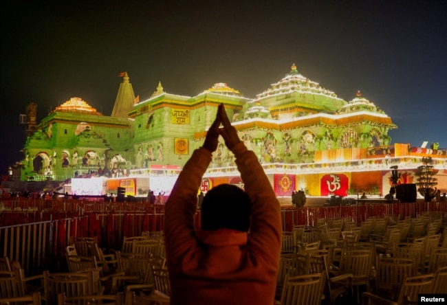 A Hindu devotee prays near the Lord Ram temple after its inauguration, in Ayodhya, India, January 22, 2024. (REUTERS/Adnan Abidi)