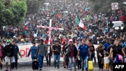 Migrants take part in a caravan towards the border with the United States in Tapachula, Chiapas State, Mexico, Dec. 24, 2023. (Photo by AFP)